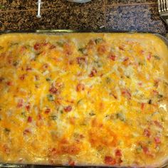 a casserole dish with cheese and other toppings on a kitchen counter top