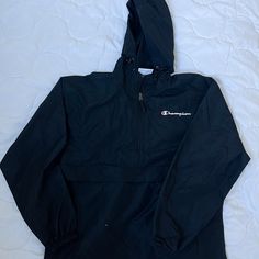 New Black Champion Packable Jacket - Unisex Size Medium Never Worn Black Windbreaker With Double-lined Hood For Outdoor Activities, Black Windbreaker With Drawstring Hood For Hiking, Black Hiking Outerwear With Drawstring Hood, Hooded Black Windbreaker For Hiking, Black Hiking Windbreaker With Drawstring Hood, Black Hooded Windbreaker For Hiking, Champion Windbreaker, Black Nylon Half-zip Windbreaker, Hooded Moisture-wicking Nylon Track Jacket