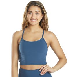 Unity is strength. Strengthen your core while you workout with the Everyday Yoga Unity Crop Tank.Features Women's cropped tank top. Racerback style. Luxuriously soft fabric. Brushed elastic shelf bra. Thin elastic x-back straps. Scoop neck. Eco-friendly. Made with Recycled Polyester, a material sourced from post-consumer plastic bottles that helps lessen our impact on the world. Manufactured in a Worldwide Responsible Accredited Production (WRAP) factory. Details Fabric: 79% Recycled Polyester, Unity Is Strength, Everyday Yoga, Auburn Red, Strengthen Your Core, After Workout, Tank Top Bras, Yoga Shop, Shelf Bra, Yoga Women