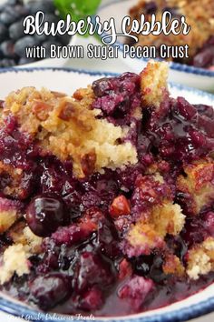 A bowl filled with blueberry cobbler and topped with brown sugar pecan crust. Pudding Chomeur, Blueberry Pudding Cake, Monkey Breads, Easy Blueberry Cobbler, Blueberry Pudding, Berry Cobbler Recipes, Blueberry Cobbler Recipes, Pecan Crust