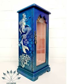 a blue cabinet with an image of a mermaid on it