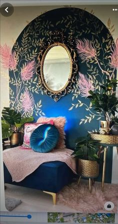 a room with a bed, mirror and potted plants on the side table in front of it