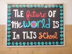 a sign that says the future of the world is in this school on a wall