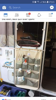 the back end of a bus with its door open and various items in it on display