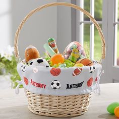 a basket filled with toys sitting on top of a table