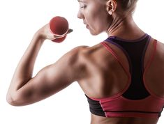 a woman holding an apple in her right hand and looking at it with both arms