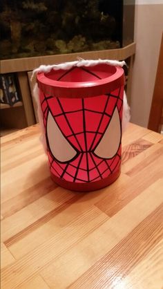 a paper cup with a spiderman face on it