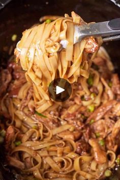 the pasta is being cooked in the crock pot with a ladle full of it