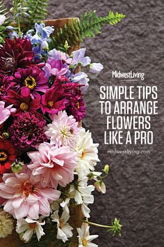 a bunch of flowers sitting on top of a wooden chair with the words, simple tips to arrange flowers like a pro