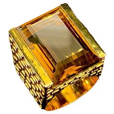 The large Emerald Cut Whiskey Quartz set within a deeply chiselled 'Brutalist' mount; this is a fabulously striking ring entering on a beautifully cut, bright & well proportioned stone. The stone measures 22mm x 15mm; the ring stands 11mm 'proud' on the finger. This ring is a US size 8. While it can not be re-sized, it is available to order in other sizes. Luxury Faceted Topaz Ring, Luxury Faceted Rings For Formal Occasions, Luxury Diamond Cut Collectible Rings, Luxury Collectible Diamond Cut Rings, Ring Stand, Cocktail Rings, Emerald Cut, Whiskey, Emerald