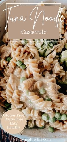 a bowl filled with pasta and vegetables on top of a table