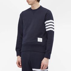 This navy blue sweater from.Thom Browne.is equal parts elegant and sporty. It teams premium cotton jersey with ribbed trims for all-day comfort, while the American designer’s iconic four-bar branding on the left sleeve and tricolour taping in the side seam complete the look..100% Cotton.Woven Brand Patch.Ribbed Trims.Made in Japan.Model is 6ft/1.82m with a 35.5”/90.2cm chest and wears a size 2. Bar Branding, Japan Model, Navy Blue Sweater, Sweat Top, Blue Sweater, American Design, Thom Browne, Blue Sweaters, Tri Color