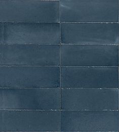 a blue tile wall with white lines on it