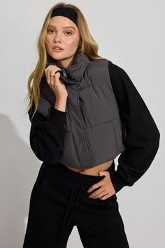 This techy look is iconic <3 Features - Stand collar - Front zip closure with snap button placket - Two welt pockets with snap closure - Zip pocket at interior - Lined Size & Fit - Fit: Fitted - Length: Cropped - The model is wearing size S Materials & Care - Content: 100% Recycled Polyester - Care: Dry clean only - Imported Look Techno, Puff Vest, Puffer Vest, Button Placket, Welt Pockets, Welt Pocket, Snap Button, Stand Collar, Snap Closure