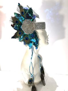 Worrier headdress- Festival Wear- Music Festival Headpiece- Peacock Headpiece- Queen Costume Hello, This headband can be worn for a music festival, costume, music festival or for performances. The round rhinestone bases are 3 inches wide with clear stones that are light weight setting. The leaves are sequins and covered with matching glitter on the edge. Each side is 12 inches high and 6 inches wide. Each side has 4 large peacock feathers. It is placed on each side with a matching clear rhinesto Peacock Crown, Headdress Festival, Peacock Headpiece, Peacock Feather Headpiece, Hat With Peacock Feathers, Gold Crown Headband, Adjustable Blue Feather Headpiece, Goddess Hair, Pastel Goth Outfits