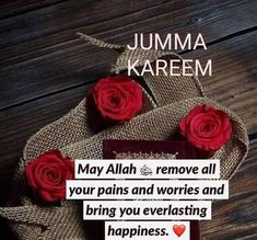 some red roses are on top of a burlock with the words jumma kareem