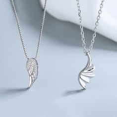 Embrace your celestial love with our Matching Angel Wings Necklaces for Couples. These enchanting necklaces feature delicately designed angel wings, symbolizing protection and love. Crafted with care, they serve as a beautiful reminder of your shared journey. Wear these necklaces with pride and let your love take flight. Material: 3 Layers 18K White Gold Plated 925 Sterling Silver Women Chain Length: 40+5cm ~ 17inches Men Chain Length: 50+5cm ~ 21inches Angelic Sterling Silver Jewelry For Gifts, Silver Angel Wings Necklace As Gift, Elegant Angel Wings Necklaces, Wing-shaped Sterling Silver Necklace, Elegant Silver Winged Necklace, Elegant Winged Silver Necklace, Silver Angel Wings Pendant Necklace, Winged Sterling Silver Necklace For Gift, Elegant Silver Necklace With Angel Wings