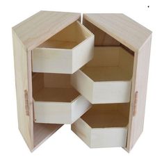 an open wooden box with three sections cut out to look like hexagons