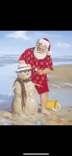 santa claus is building a snowman on the beach