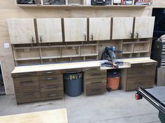 the workbench has many drawers and tools on it