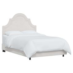 a bed with white linens and pillows on top of the headboard, in front of a white background