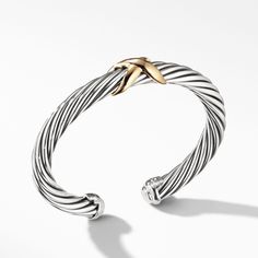 David Yurman's artistic signature, Cable began as a bracelet that he hand-twisted from 50 feet of wire. For the past 30 years, he has evolved the twisted helix into a myriad of designs. Sterling Silver and 14-karat Yellow Gold Bracelet, 7mm Size Small: Fits a wrist measuring 5.5-6 inches in circumference Style Number: B06139 S4S David Yurman Bracelet, Station Bracelet, Yellow Gold Bracelet, Gold Collection, David Yurman, Chain Pendants, Bracelet Designs, Womens Bracelets, Ring Earrings