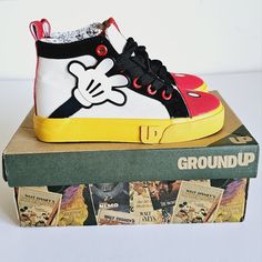 Adorable! Mickey Mouse High Top Color Block Sneakers. Size 12m New In Box. Playful Yellow Lace-up Sneakers, Casual High-top Mickey Mouse Sneakers, Playful Yellow Sneakers With Round Toe, Yellow Round Toe Sneakers For School, Fun School Sneakers With Rubber Sole, Playful Sneakers With Rubber Sole For School, Playful Yellow Sneakers For Playtime, Yellow Low-top Sneakers For Playtime, Fun Non-slip Sneakers For School