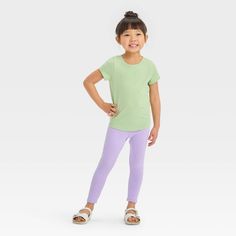 This Short-Sleeve Solid T-Shirt from Cat & Jack™ makes a great casual wardrobe staple for your little one. Tailored in a relaxed fit, this short-sleeve T-shirt is crafted from lightweight fabric for all-day cool comfort, while the below-hip length makes it easy to wear either tucked in or untucked. Designed in a solid hue, this crewneck tee makes an easy pairing with various pants, shorts or skirts for versatile outfit options. Cat & Jack™: Kids’ clothing with an imagination of its own. Playful Short Sleeve Top, Basic Spring Playwear Tops, Basic Tops For Playwear In Spring, Basic Spring Tops For Playwear, Green Relaxed Fit Tops For Playwear, Relaxed Fit Green Tops For Playwear, Playful Solid Color Tops For Playwear, Stretch Solid Tops For Playwear, Solid Stretch Tops For Playwear