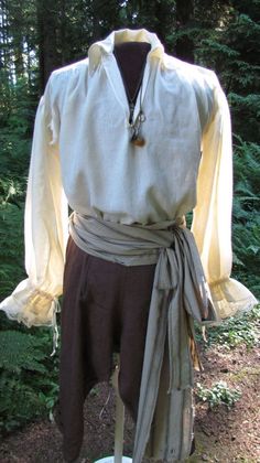 Pirate Themed Outfit Male, Pirate Undershirt, Medieval Mens Outfit, Simple Medieval Outfit Male, Mens Ren Faire Outfit Pirate, Ren Fair Male Outfit, Mid Evil Outfits Men, Commoner Clothing Male, Men’s Pirate Outfit