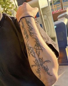 a man with a tattoo on his arm