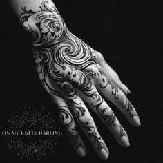 a person's hand with tattoos on it and the words on my hands daring