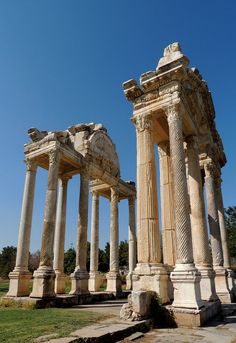 the ruins of an ancient city with columns