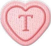 a pink heart with the letter i in it's center, embroidered on top