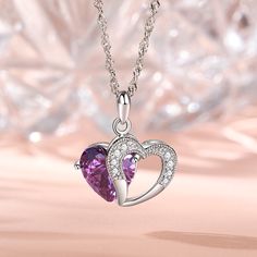 A sparkling tribute to you, this heart necklace is a special look you are certain to adore. Crafted in sterling silver, it features a shimmering purple heart-shaped stone with an open heart-shaped frame. Smaller stones adorns heart frame, adding subtle sparkle. It's a sweet and romantic gift for you or your loved ones.Carat Weight: 5.97 ctStone Size: 10*10 mmStone Type: Jeulia® StoneNumber of Stones: 1 Stone Color: Amethyst PurpleStone Shape: HeartCarat Weight: 0.374 ctStone Size: 1.3,1.5 mmSton Purple Heart Cut Sterling Silver Necklace, Purple Heart-cut Sterling Silver Necklace, Sterling Silver Purple Heart Pendant Necklace, Purple Sterling Silver Heart Pendant Necklace, Purple Sterling Silver Necklaces For Valentine's Day, Purple Sterling Silver Heart Cut Necklace, Purple Cubic Zirconia Jewelry For Valentine's Day, Purple Heart Cut Necklace For Valentine's Day, Purple Heart Pendant Necklace For Valentine's Day