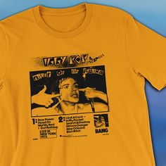 a yellow t - shirt with an image of a man's face on it