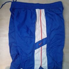 Deadstock Vintage 90s Nike Wind Shorts Athletic, Side Pockets - Size XX-Large, Measures Adjustable Drawstring Elastic Waist(Flat)=16.5" Inseam=9" Front Rise=15" - Blue/White/Orange Color Way Throwback Sports Shorts, Retro Stretch Sports Bottoms, 90s Style Blue Sports Bottoms, Retro Stretch Bottoms For Sports, Vintage Sports Bottoms For Summer, 90s Style Sports Shorts, Vintage Blue Sports Shorts, Retro Athletic Shorts For Sports, Casual Blue Athletic Shorts For Jogging