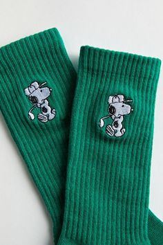 Snoopy embroidery crew socks. Everyday socks with a ribbed knit ankle cuff. Features Crew length socks Ribbed knit ankle cuff Embroidered Snoopy motif Content + Care Includes 1 pair 95% Cotton, 3% polyester, 2% spandex Machine wash Imported | Snoopy Golf Crew Sock in Green, Men's at Urban Outfitters Gifts For College Boys, Snoopy Embroidery, Cool Socks For Men, Aesthetic Socks, Snoopy Gifts, Socks Aesthetic, Embroidered Socks, Bf Gifts, Guys Clothing Styles