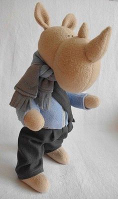 a stuffed animal is dressed in clothes and shoes