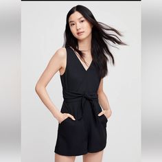 Aritzia | Wilfred Ecoulement V-Neck Tie Waist Cutout Romper Black Size 8 - Bnwt: -This Romper Version Of The Coulement Has A Subtle Back Cut Out And A Self-Tie Waist. It's Made From A Luxe Japanese Crepe With An Intricate Basketweave Texture. Invisible Zipper At Back Adjustable Wrap Tie At Waist Fully Lined Fabric From Japan, Made In China 100% Polyester; Lining: 100% Polyester Dry Clean Questions? Leave A Comment Below! Versatile Black V-neck Jumpsuits And Rompers, Japanese Crepe, Silk Romper, Aritzia Pants, Aritzia Wilfred, Cute Rompers, Sleeveless Rompers, Long Jumpsuits, Short Jumpsuit