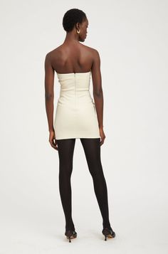 An ever-popular silhouette, our classic strapless leather dress is hand-tailored to ensure a perfect figure-hugging fit. A chic, curve-skimming style, that is guaranteed to turn heads without compromising on comfort due to its smooth cotton lining. Wear yours with chunky boots or heeled sandals and one of our colorful mini paniers. COLOR: Off White - Cream Strapless Leather Dress, Leather Strapless Dress, Perfect Figure, Suede Fashion, Chunky Boots, Leather Dress, Heeled Sandals, White Cream, Couture Fashion