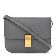 This is an authentic CELINE Liege Calfskin Medium Classic Box Flap Bag in Medium Grey. This super-chic shoulder bag is crafted of fine-textured calfskin leather in a gray. The shoulder bag features an adjustable leather shoulder strap and a frontal gold press-lock. This opens the flap to a partitioned matching leather interior with a zipper compartment and patch pockets. 1346911 Luxury Gray Shoulder Bag For Office, Luxury Gray Shoulder Bag For Formal Occasions, Gray Rectangular Shoulder Bag With Gold-tone Hardware, Elegant Gray Textured Leather Shoulder Bag, Classic Gray Shoulder Bag For Evening, Classic Gray Shoulder Bag For Formal Occasions, Classic Gray Formal Shoulder Bag, Formal Gray Rectangular Shoulder Bag, Medium Bags