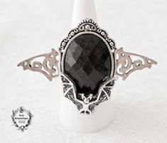 ♥♥Noir Romantique♥♥ Welcome to my store! An impressive ring to make a statement while wearing it . It features a beautiful silver bat attached to a black oval 18x25mm gem placed again over silver bat .This ring is adjustable to fit all fingers Material: Alloy It will be sent to you in a beautiful gift box gift wrapped through registered mail(this means that tracking number will be provided to you as soon as I send your order). If you have any questions feel free to ask:) Thanks for visiting! Gothic Rings, Cameo Ring, Box Gift, May 17, Beautiful Gift Boxes, Spooky Halloween, Adjustable Rings, Tracking Number, Bat