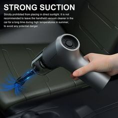 a person is using an air freshener machine to clean the interior of a car