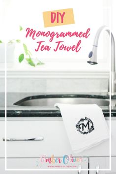 a tea towel hanging on the side of a kitchen sink next to a faucet