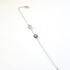 "925 Sterling Silver Rolo Chain Bracelet with Micro Pave Evil Eye and a Hamsa/Hand of Fatima set with high quality CZ's Bracelet measures approximately 6 1/2\"- 8\" inches with the 1 1/2\"inch extender. Clasp is Spring Ring. A piece where evil eye & belief come together to make a statement." Dainty Silver Evil Eye Bracelet As Gift, Silver Evil Eye Bracelet Gift, Sterling Silver Bracelets With Adjustable Chain, Sterling Silver Fine Jewelry Bracelet With Adjustable Chain, Dainty Silver Evil Eye Bracelet, Dainty Silver Sterling Evil Eye Bracelet, Elegant Sterling Silver Evil Eye Bracelet, Silver Sterling Silver Evil Eye Bracelet, Dainty Style, Silver Hand Set Chain Bracelet As Gift