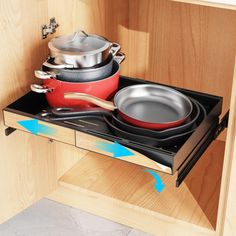 pots and pans are sitting on the burner in this kitchen cabinet door drawer