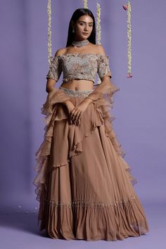 Peanut brown lehenga with layered detailing. Paired with off-shoulder top in pearl, cut bead, resham embroidery and dupatta.
Components:3
Pattern:Embroidery
Type of Work:Pearl, cut bead, resham
Neckline:Straight
Sleeve Type:Half
Fabric:Viscose
Color:Brown
Other Details:
Ruffle dupatta
Occasion:Destination Wedding - Aza Fashions Frill Dupatta, Brown Lehenga, Brown Dupatta, Layered Lehenga, Ruffle Dupatta, Net Blouse, Georgette Lehenga, Lehenga Fabric, Indian Outfits Lehenga