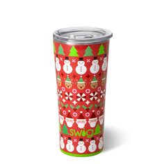 a red christmas cup with snowmen and trees on it, sitting next to a white background