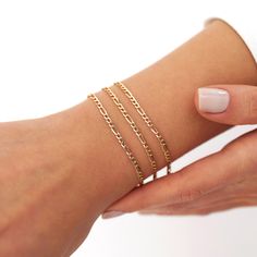 Our new simple and dainty Figaro chain bracelets, as always made in 14k solid gold. You can wear this bracelet with a free mind without worrying about water, perfume, or conditioner contact since real gold never tarnishes.★ Features of the Bracelet (this listing is for a single bracelet only)• Gold Kt: 14K Solid Gold (all pieces are stamped for authenticity)• Available Gold Color: Yellow Gold• Chain Width: 2.5 mm Dainty 14k Gold Bracelets With Adjustable Chain, Dainty 14k Gold Link Bracelet, Dainty Gold Plated Bracelet With Figaro Chain, Dainty Gold-plated Bracelet With Figaro Chain, Dainty Yellow Gold Diamond Bracelet, Dainty Yellow Gold Chain Bracelet, Dainty 14k Gold Bracelet With Gold Chain, Dainty Gold Figaro Chain Bracelet, Dainty Gold Bracelet With Figaro Chain