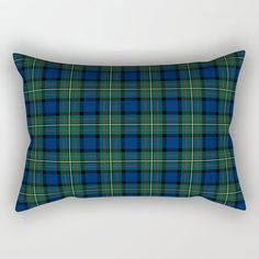 a blue and green plaid rectangular pillow on a white background with the words, scottish tartan